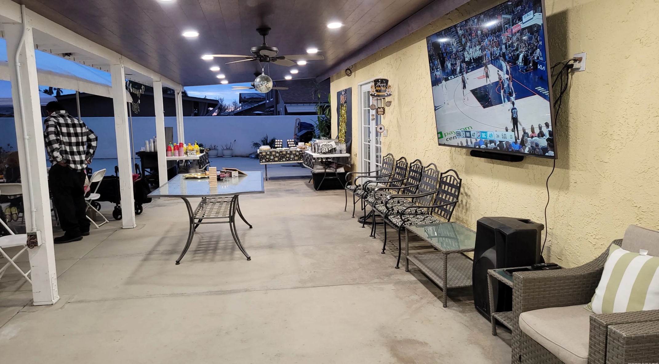 Evening patio with TV and guests