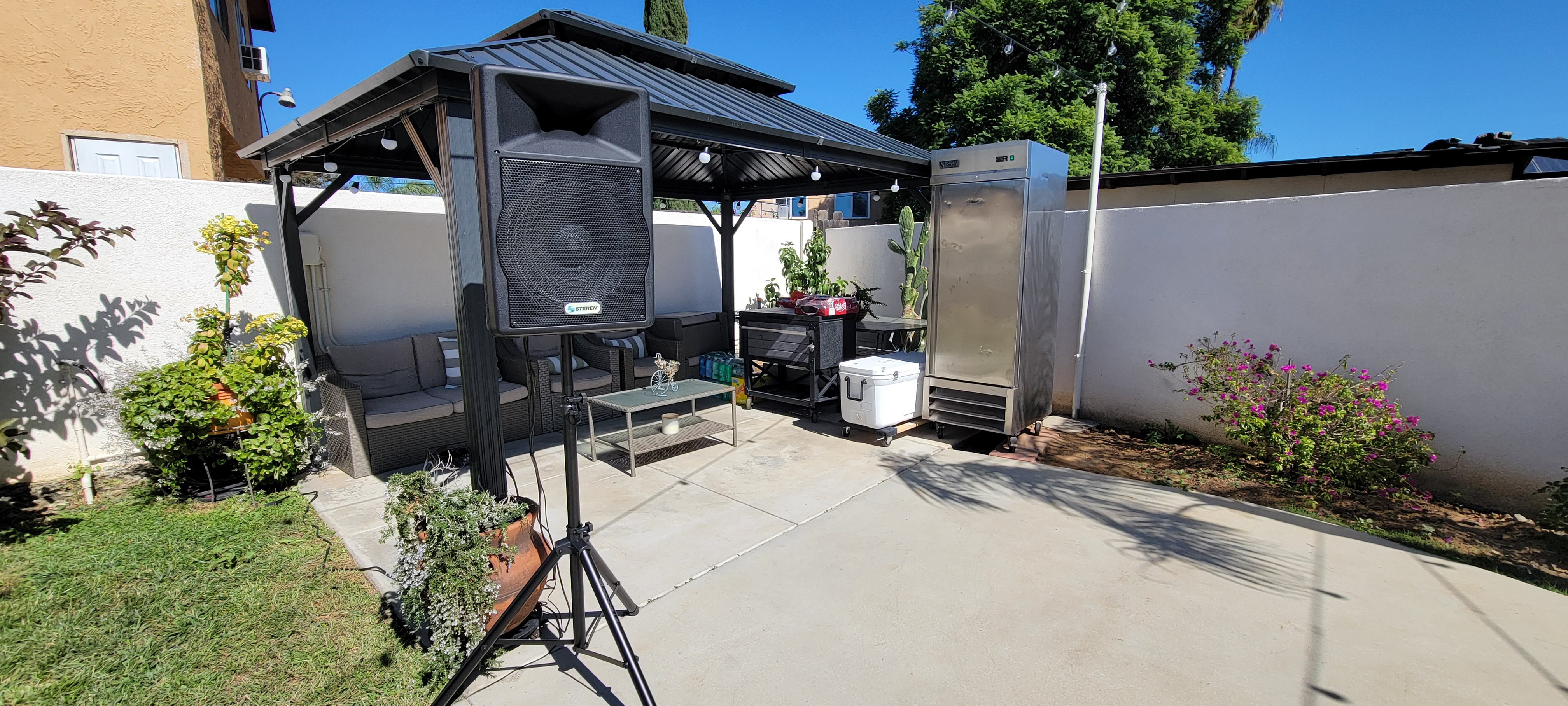 Gazebo with speakers and cooler setup