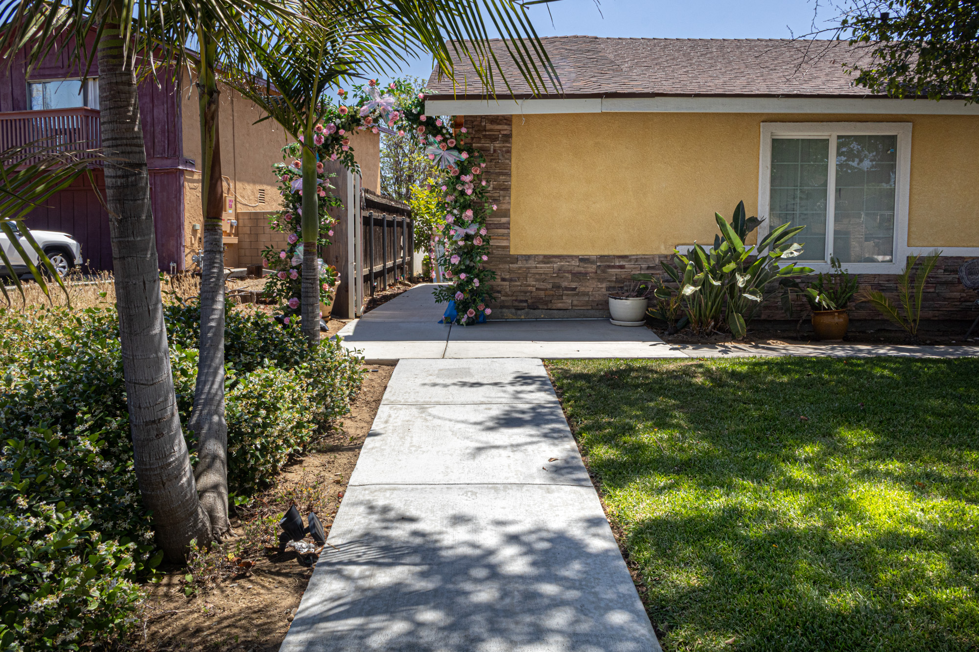 Entry pathway with floral arch